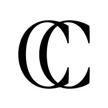 Jeremiah Brent's New York home office with custom cabinets, open shelves, and drawers for fabrics by California Closets